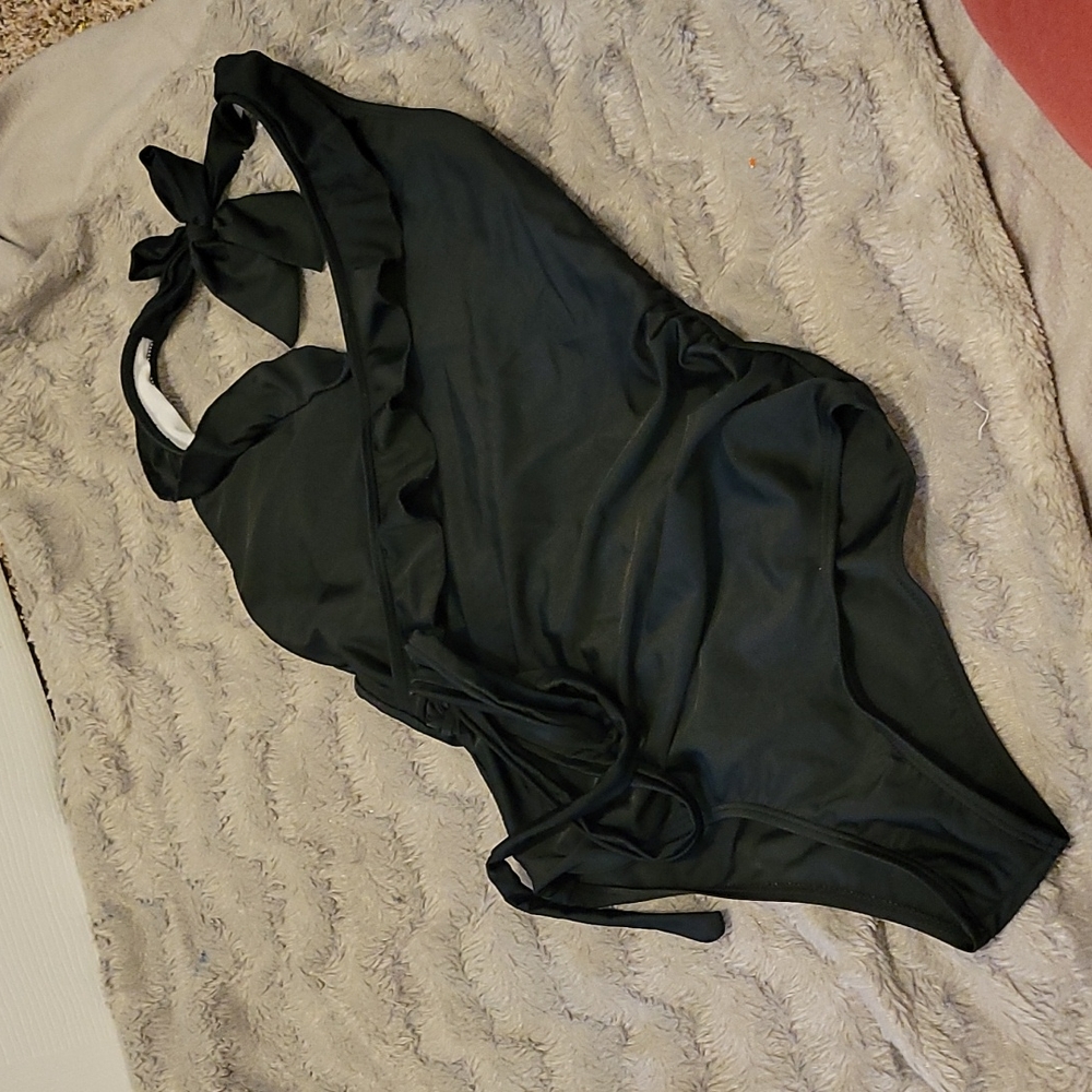 Black one piece bathing suit.